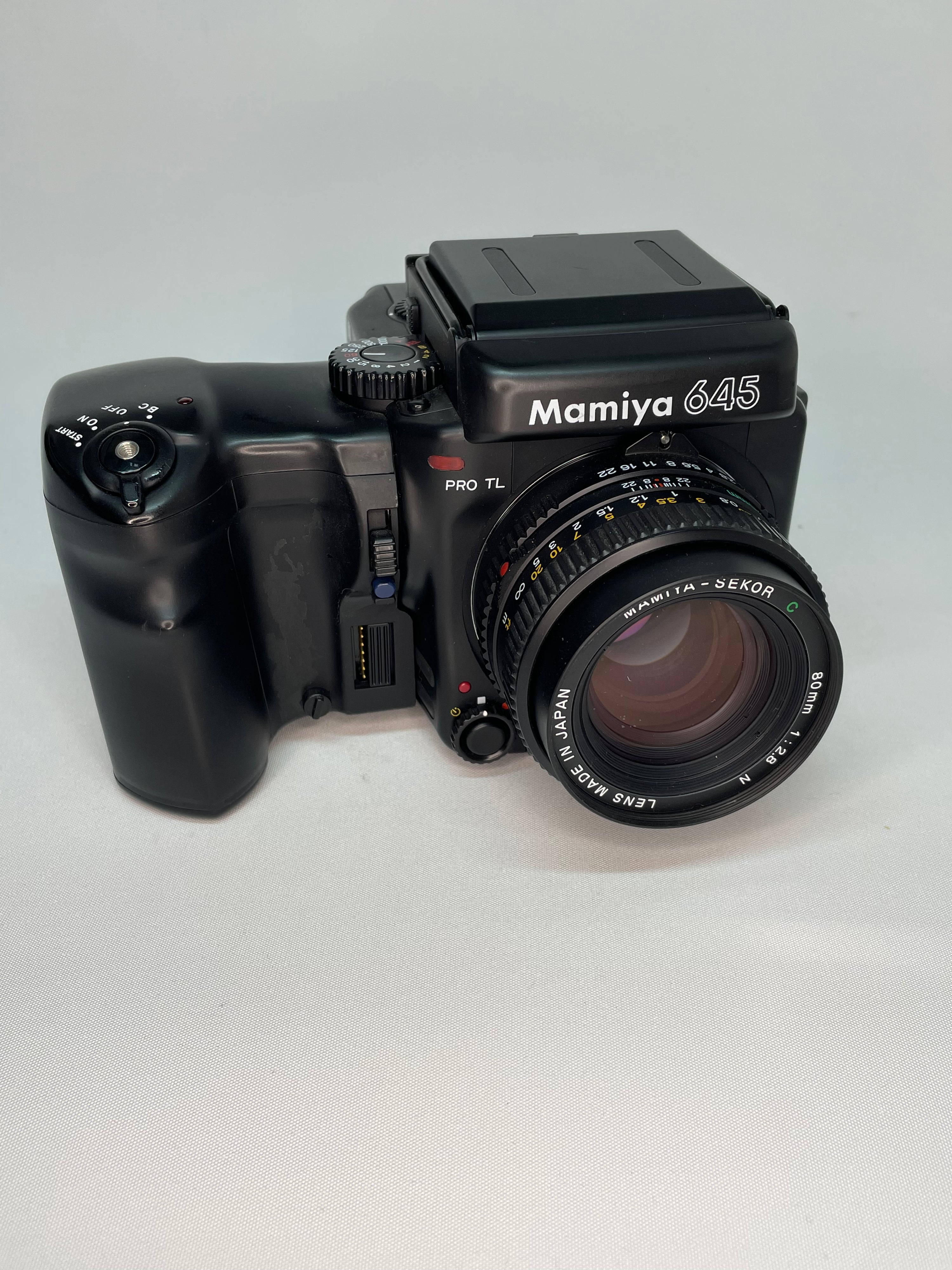 Mamiya 645 Pro TL and 80mm lens with waist level finder, additional winder, polaroid back and tripod adaptor. Excellent conditon