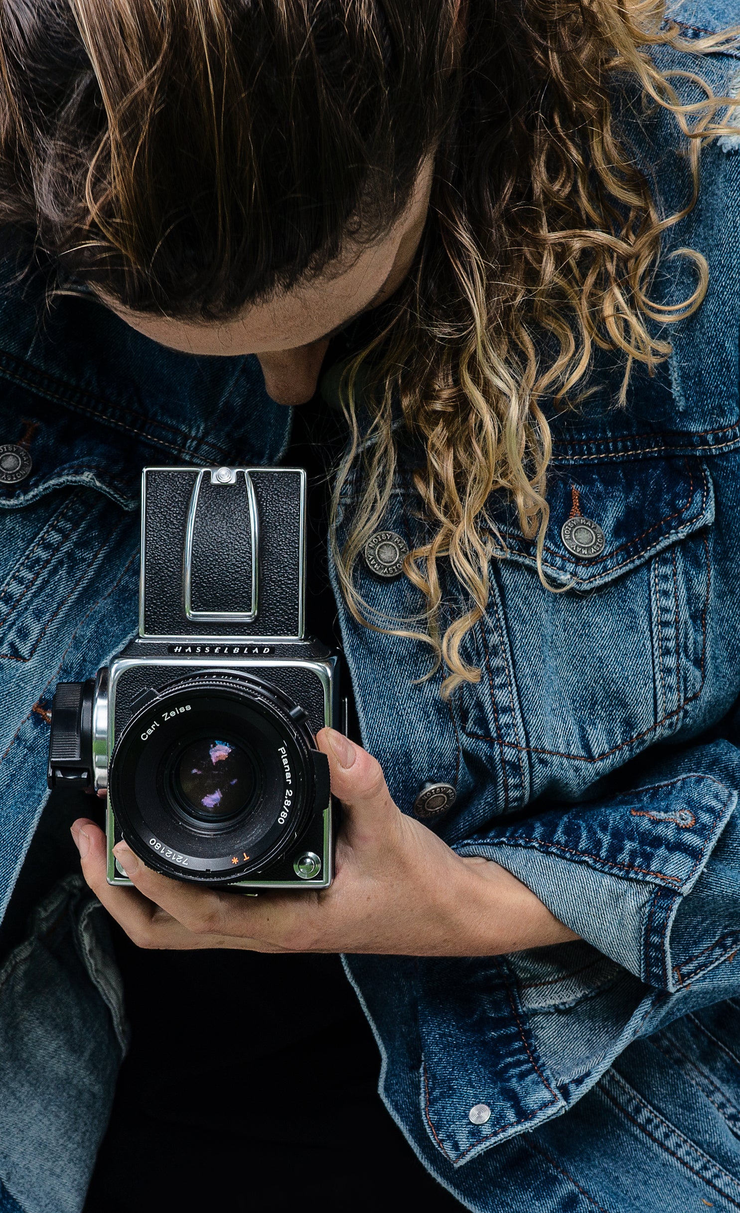 A person using a Hasselblad camera