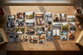 An arrangement of 6 x 4 photographs arranged over a kitchen table